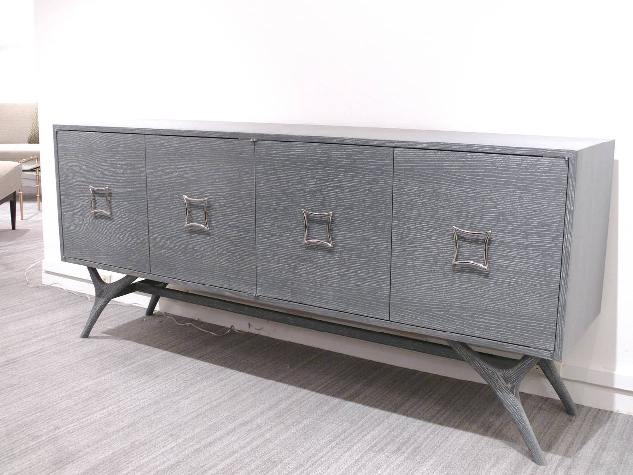 Exceptional four-door credenza by Irwin Feld Design for CF Modern. Shown in grey cerused oak with polished nickel-plated hardware, we offer custom sizes and finishes. We can customize this piece to your specifications, add drawers and change the