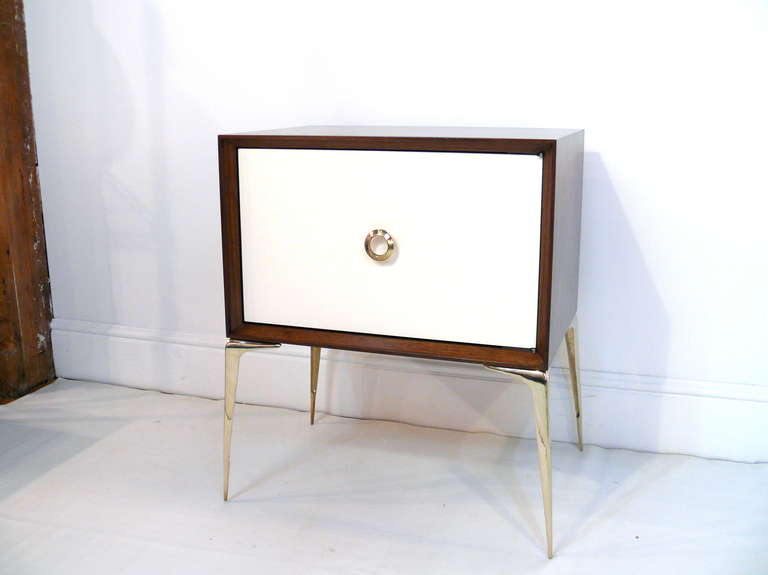 A new twist on our Classic stiletto Stand designed by Irwin Feld Design for CF Modern. Shown here in natural walnut with a white door and polished hand cast brass legs and pulls, let your imagination run wild with new combinations. Nickel available