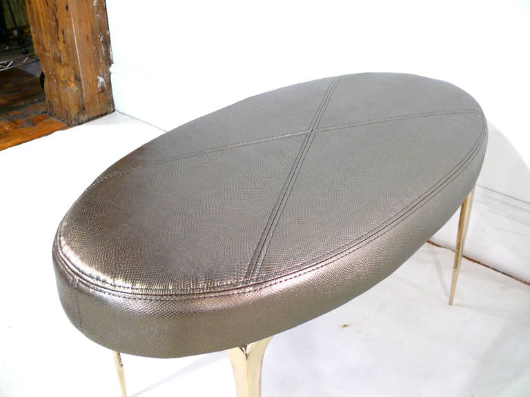Brass Pair of Oval Stiletto Ottomans For Sale