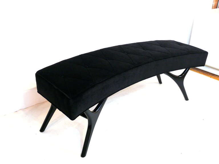 Our Finn leg bench takes a new turn in this curved edition by Irwin Feld Design for CF Modern. Legs are shown in black lacquer with a seamed and buttoned diamond top.  Custom sizes, other finishes, other wood species and COM available. Lead Time: