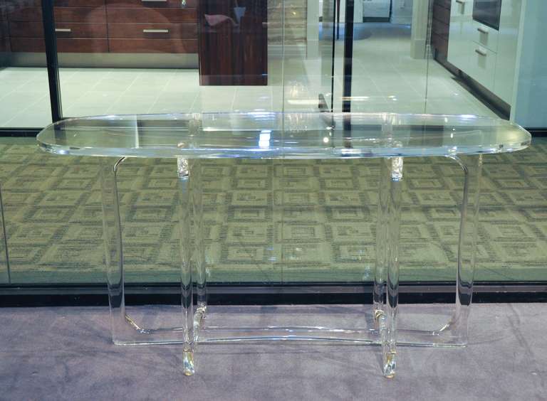 CF Modern expands it stance in lucite with this console table by Irwin Feld Design.  Hand made a flame polished, this sculptural table is available in custom sizes withbases up to 48