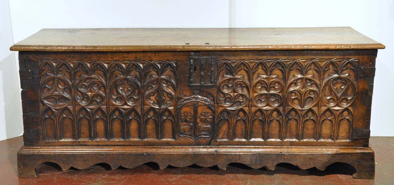 18th century carved chestnut Spanish trunk on attached wooden base
 (c: 1760). Wonderful hardware on the front and both sides. Deep and rich patina. Because of its great size, it would make a wonderful 