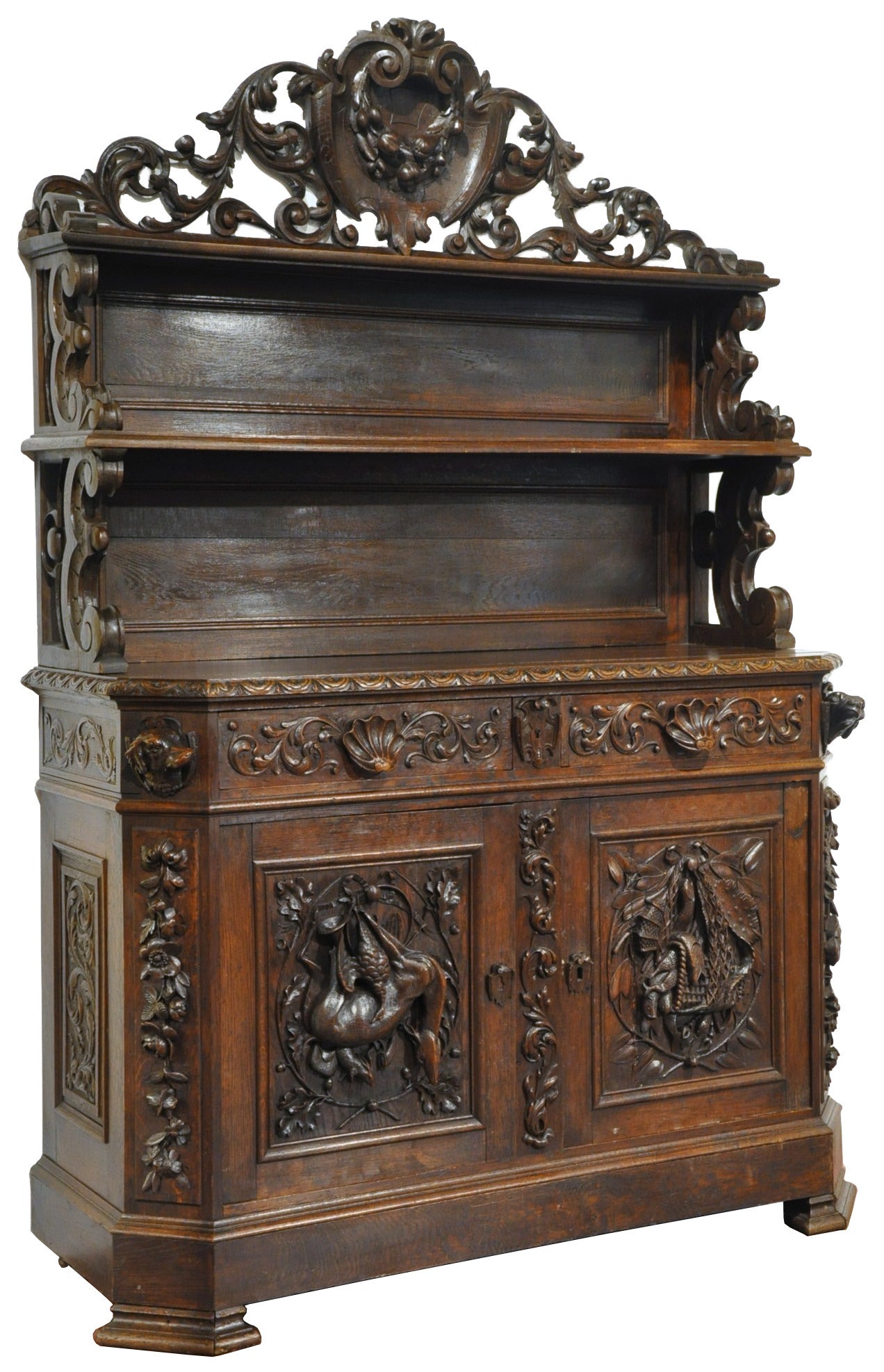 This elegant, two-piece antique display cabinet was crafted in France, circa 1870. The ornate buffet features a double display shelving on the top, and two doors with drawers at the base revealing inside shelf for extra storage. The buffet is