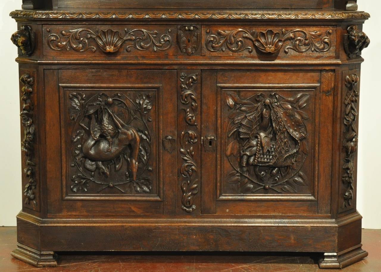 Patinated 19th Century French Black Forest Carved Oak Display Buffet with Hunt Motifs