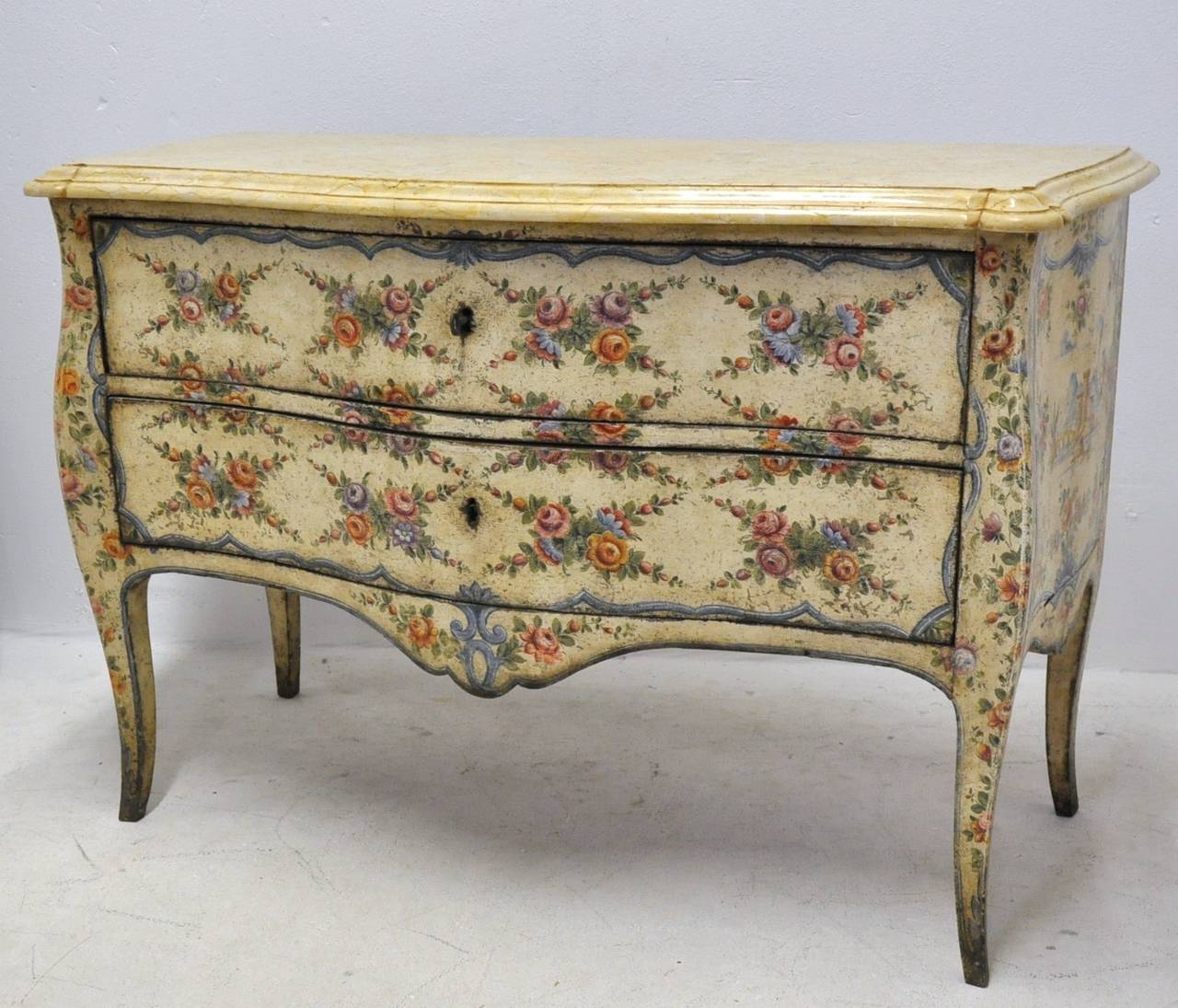 Fabulous venetian painted commode from Italy with marble top (c:1760). The paint is original on all 3 sides, the colors are still very fresh and vibrant. The original wood top is still available, but we replaced it with a beige stone.