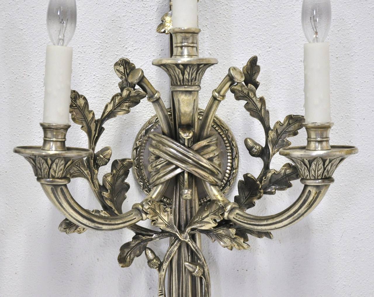 Fabulous pair of silver bronze sconces with 3 arms and waxed candles. Re-wired.