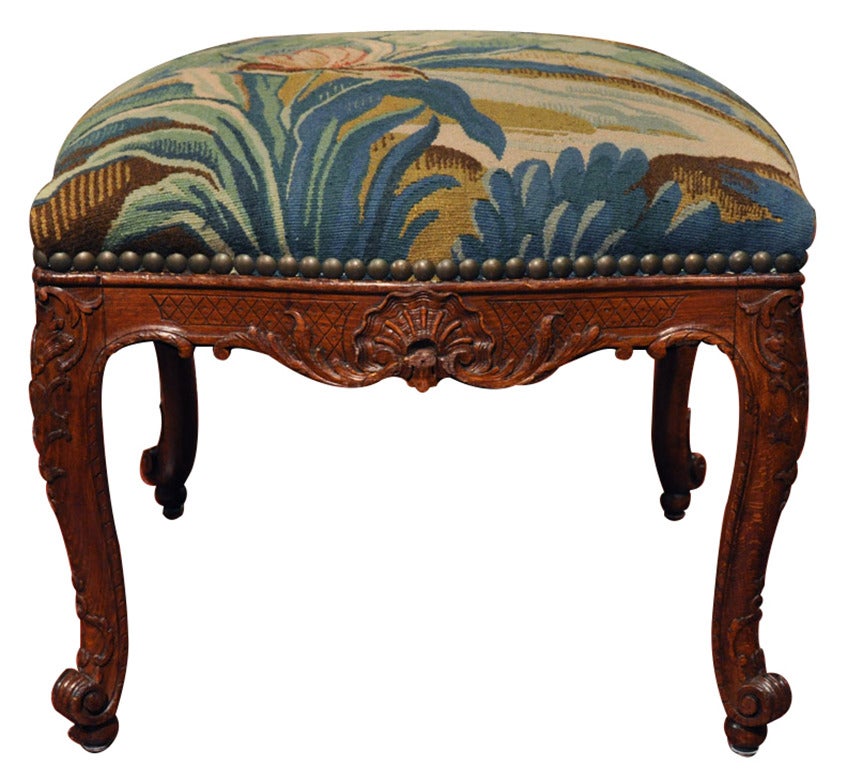 Louis 15 walnut stool covered with Aubussson tapestry (c:1870). Completely redone with new padding and new nail heads.