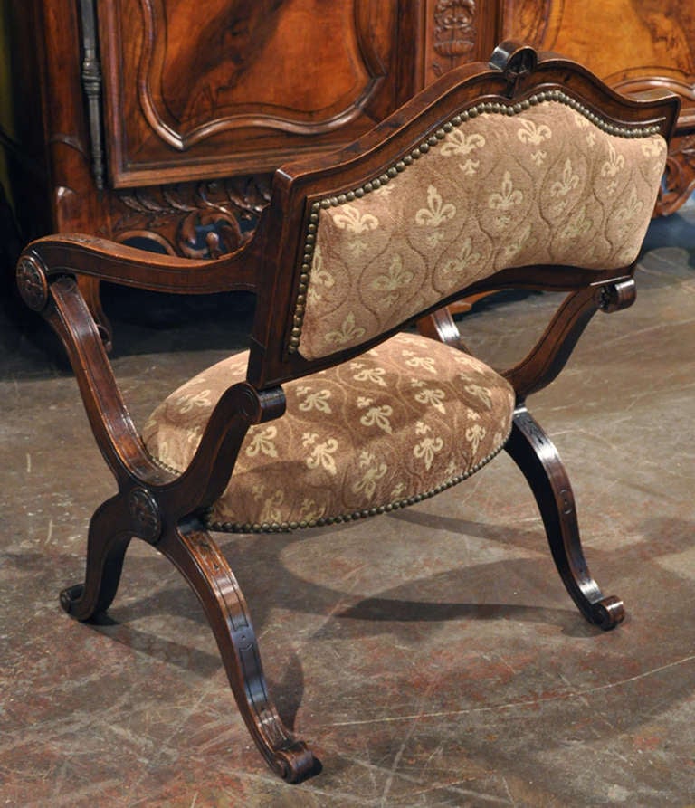 This rare, carved walnut metamorphic prayer chair (Prie Dieu in French) was crafted in France, circa 1860. The unique, antique chair is easily transformed and can open up to a tall prayer kneeler bench. The piece has been recently re-padded and