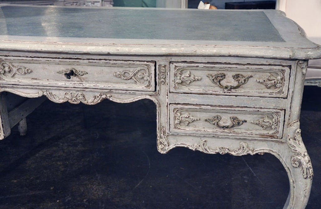 Wonderful Antique Louis XV style Partners Desk.  Both sides have independant drawers in the same configuration.  Desk was recently painted to fit with modern style. The beautiful faux leather design on the top gives this desk new life.