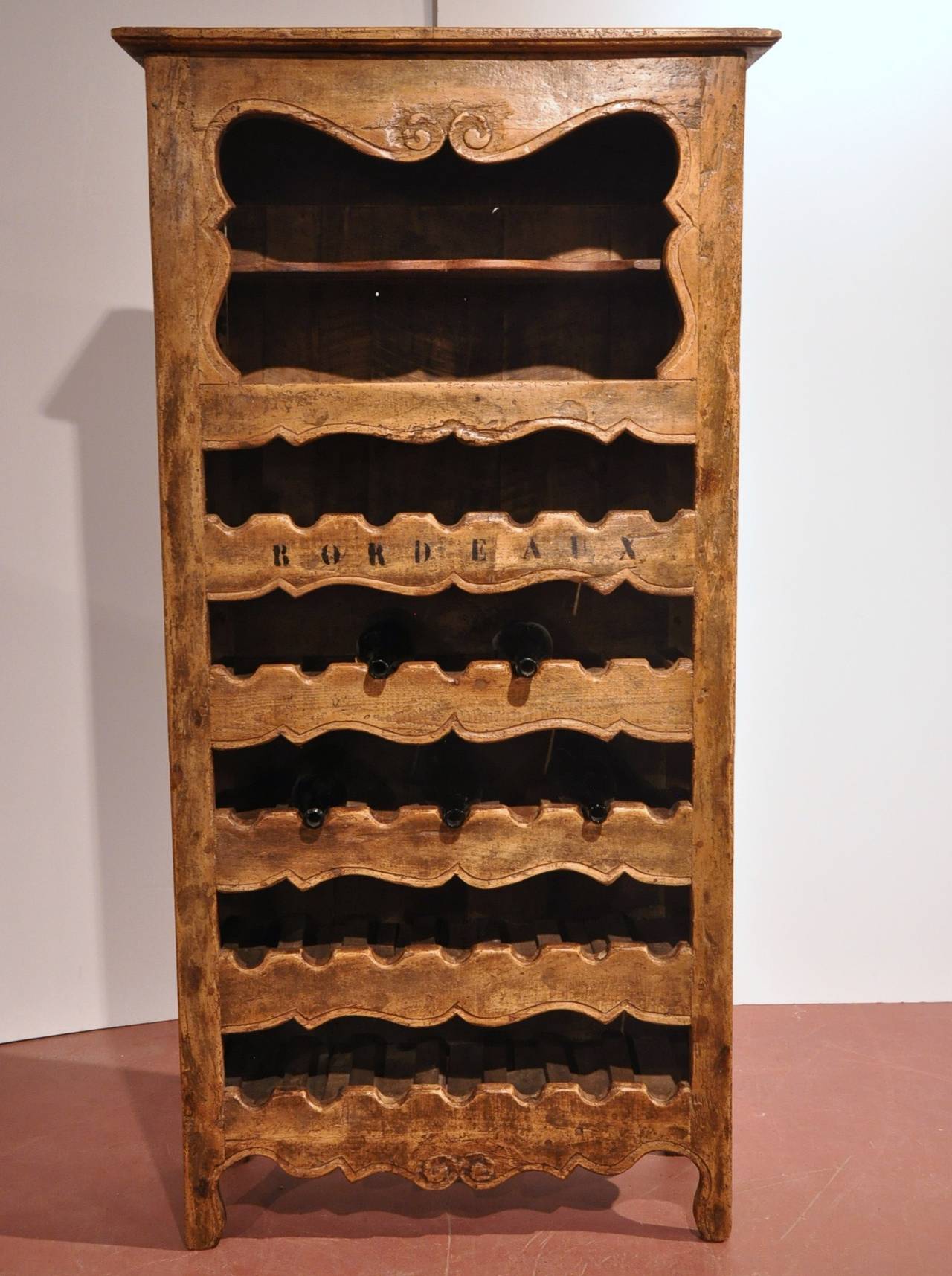 Antique wine bottles holder cabinet from the Poitou region of France. A great accent piece for a wine cellar, a den or a kitchen. Restored.