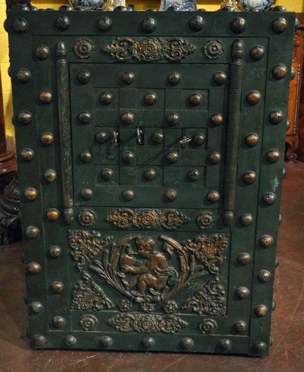 Manufactured by Perreymond-Brevete in Marseilles, France, this stunning French hobnail safe is in top working condition with its 3 original keys.  The safe front has sliding mechanisms to hide the 3 locks when not in use. The inside of the safe has