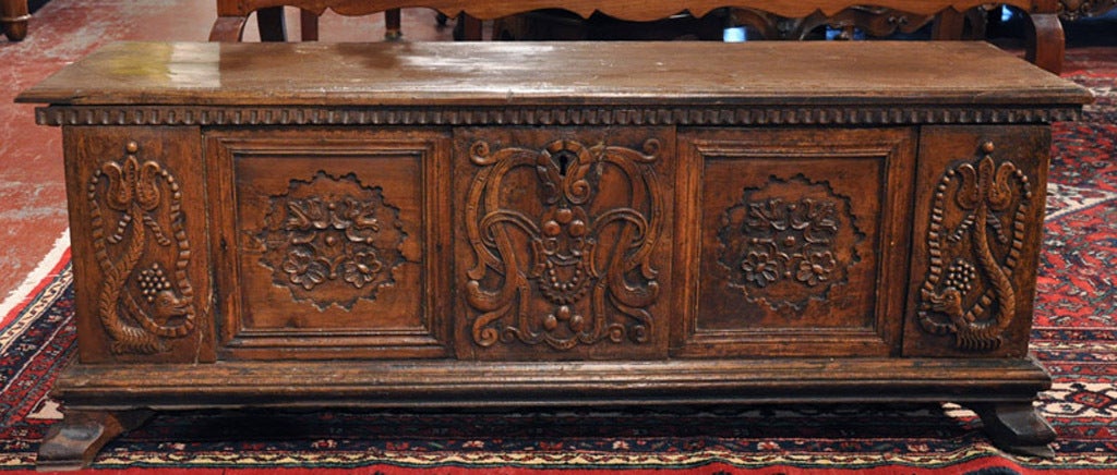 This beautiful 17th century cassone (coffre or trunk) features various hand carved motifs from nature in walnut. Cassones were often made as a marriage gift, and serve a variety of decorative and storage purposes. Perfect for storage at the end of a