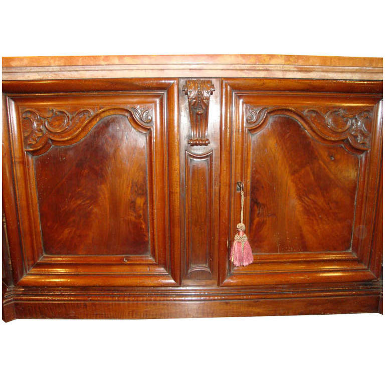 This exquisite antique Regence buffet was carved in Lyon, France, circa 1760. The fruit wood powder room vanity is topped with the original 18th century 5