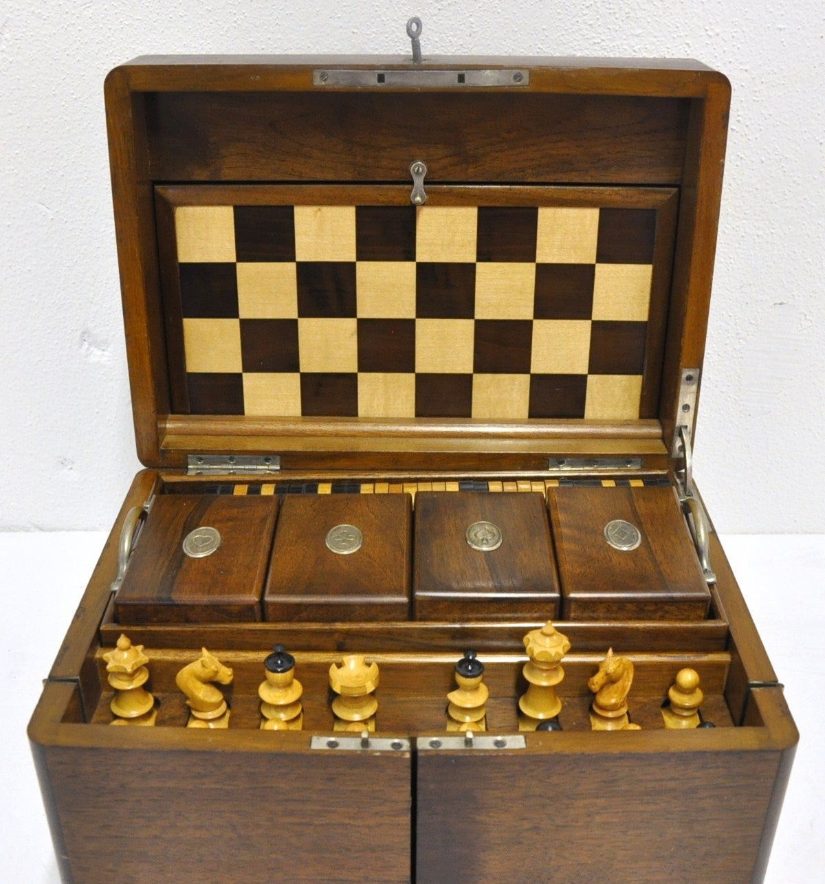 Fabulous 19th century walnut game set box, circa 1880. The hinged top opens to a case fitted for chess, checkers, backgammon, a domino game, numerous poker chips, four wood card holder boxes, two slates black boards with pens...and much more!