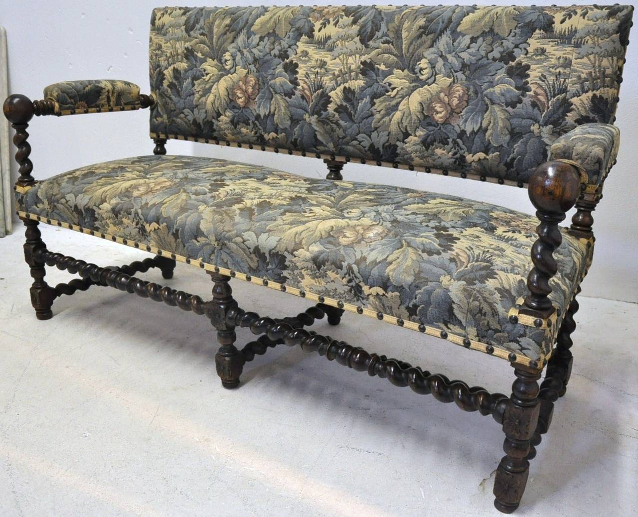 Fine Louis XIII walnut antique settee banquette on six barley twist legs, circa 1860. Recently recovered in France.