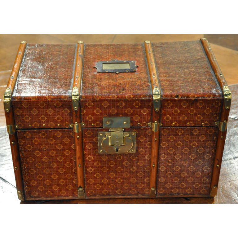 Elegant small trunk or box covered with leather, wood trim around, brass findings, hardware, key. The inside is covered with a beautiful vintage floral silk fabric.