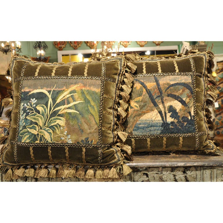 Embellish your king or queen sized bed, or even your formal living room seating, with this pair of colorful handmade square pillows with matching long pillow. Each piece is made using antique verdure Aubusson tapestry fragments, velvet, French
