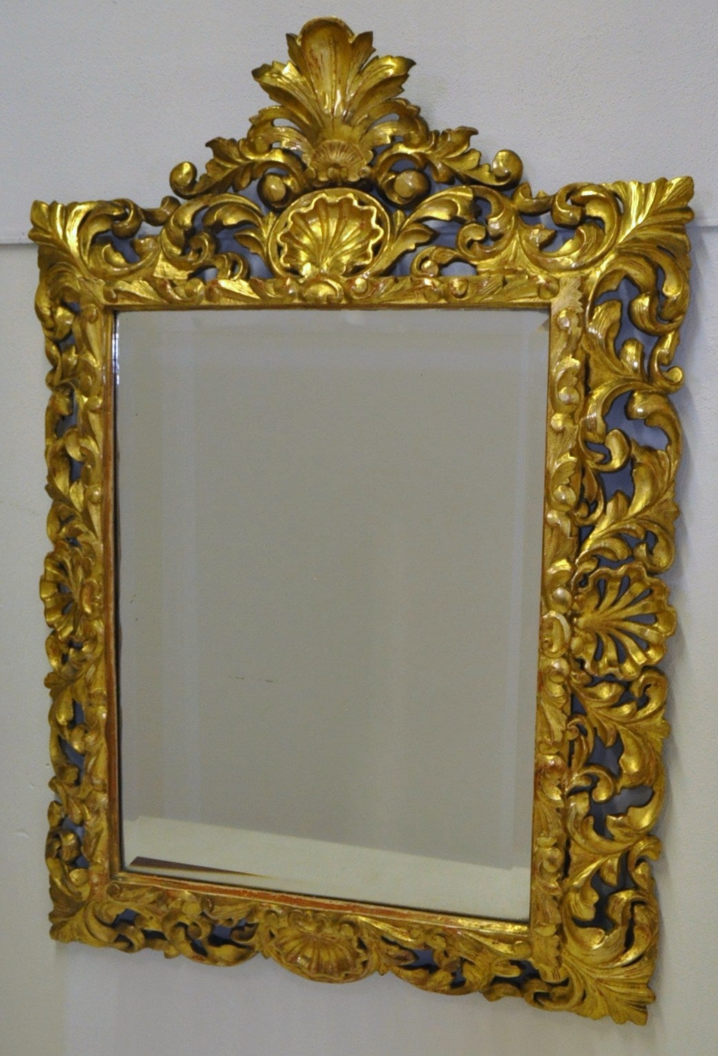 Elegant 19th century wood gold-leaf mirror with original beveled glass (C:1870).
Fabulous finish!
