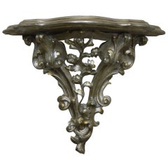 Large Silver Leaf Carved Wall Bracket Adorned with Scrolls and Flowers