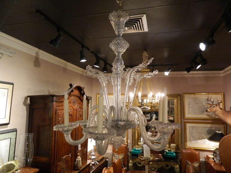 Large Venetian six-light chandelier in clear handblown glass embellished with folded and curled leaf forms, circa 1920s.