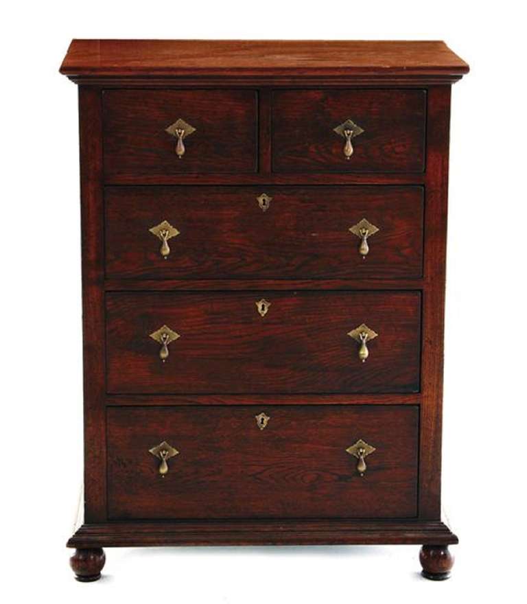 19th century English oak chest of drawers, two over three drawers, on round feet.