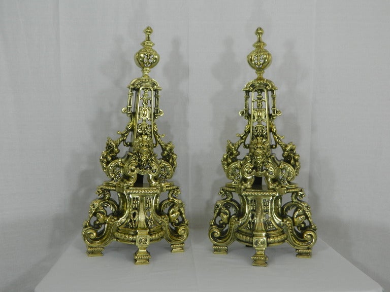 19th Century Pair of Tall Chenets or Andirons with Fleur de Lis, Dragons, and Flowers Motif.  It also Includes a Center Bar or Fender