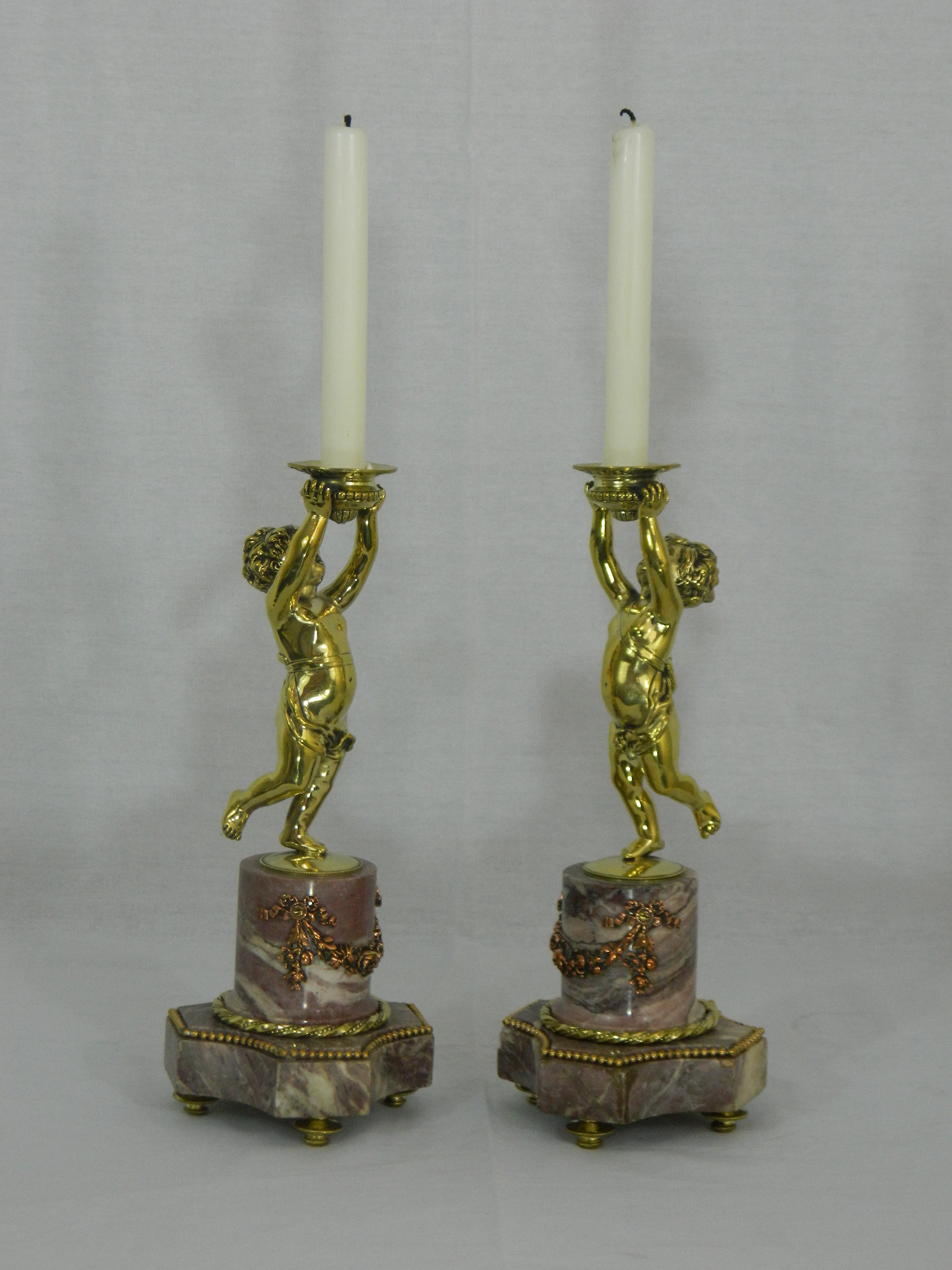 Pair of Candlesticks with a Cherub Motif and a Marble Base, 19th Century