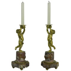 Pair of Candlesticks with a Cherub Motif and a Marble Base, 19th Century