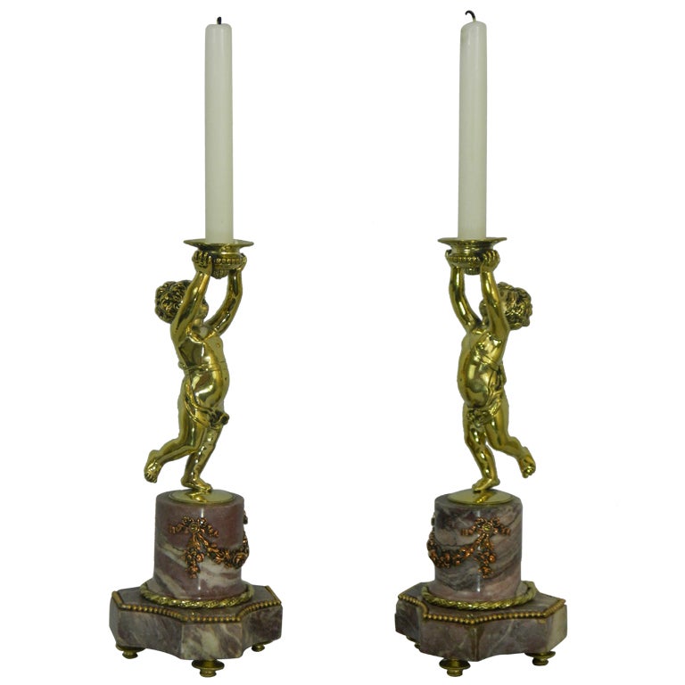 Pair of Candlesticks with a Cherub Motif and a Marble Base, 19th
