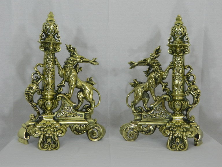 Pair of 19th century tall chenets or andirons with a decorative finial top, dragons shooting fire motif base. It also includes a center bar or fender. Dimensions: 56