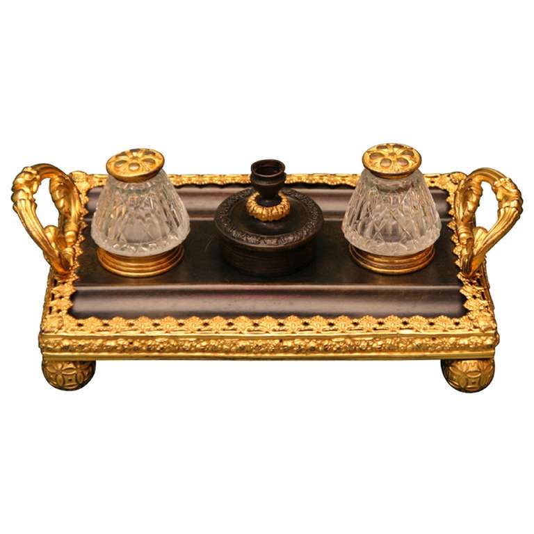 19th Century Regency Gilt and Patinated Bronze and Cut Glass Standish Inkwell with Two Ink Pots Centered by a Candlestick Flanked by Loop Handles