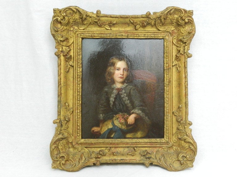 19th century portrait of girl with hat, oil on board. Signed and dated 1898 on lower right, in a giltwood frame. Robert Steele (British, 1863-?). Dimensions of board 11.5