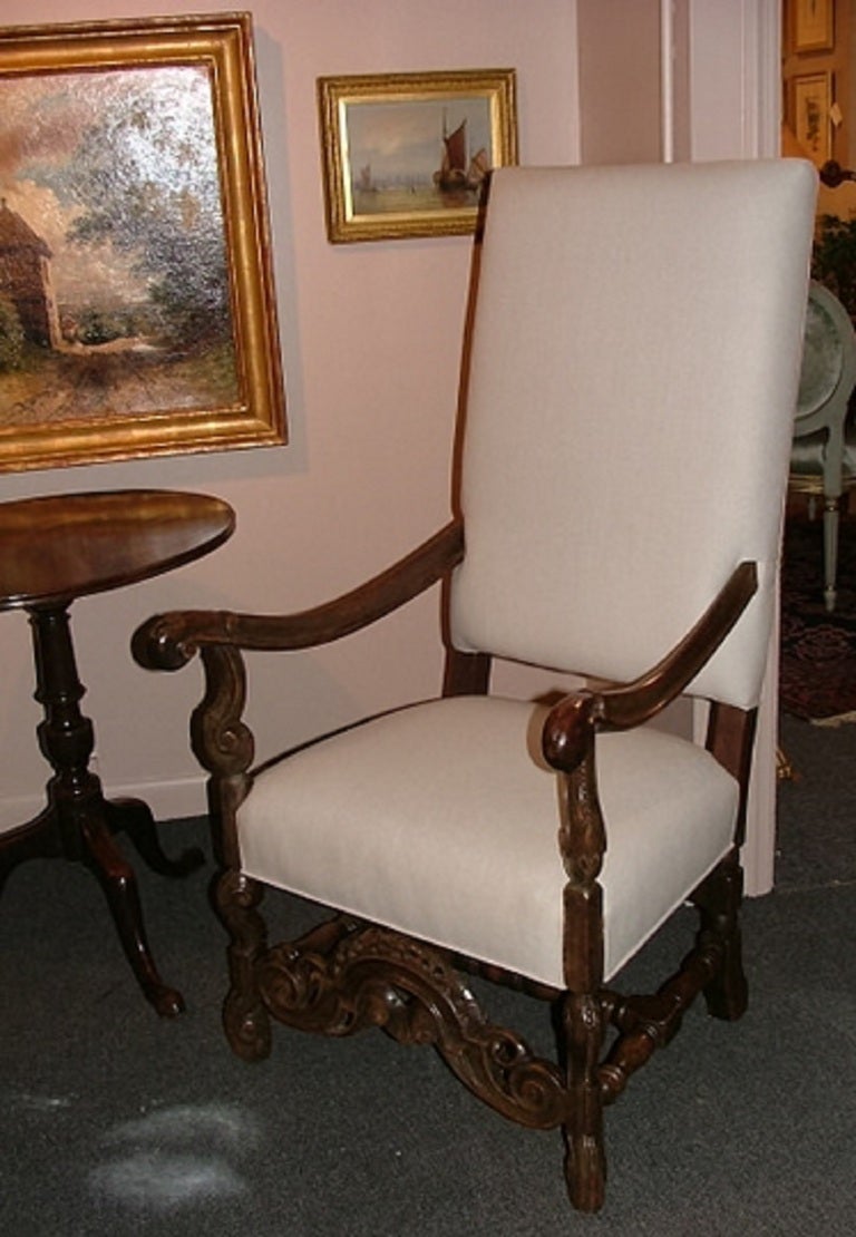 19th century English oak armchair upholstered in linen.