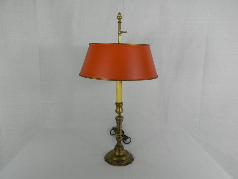 19th century Regence style gilt-metal candlestick lamp with a tin shade.
 