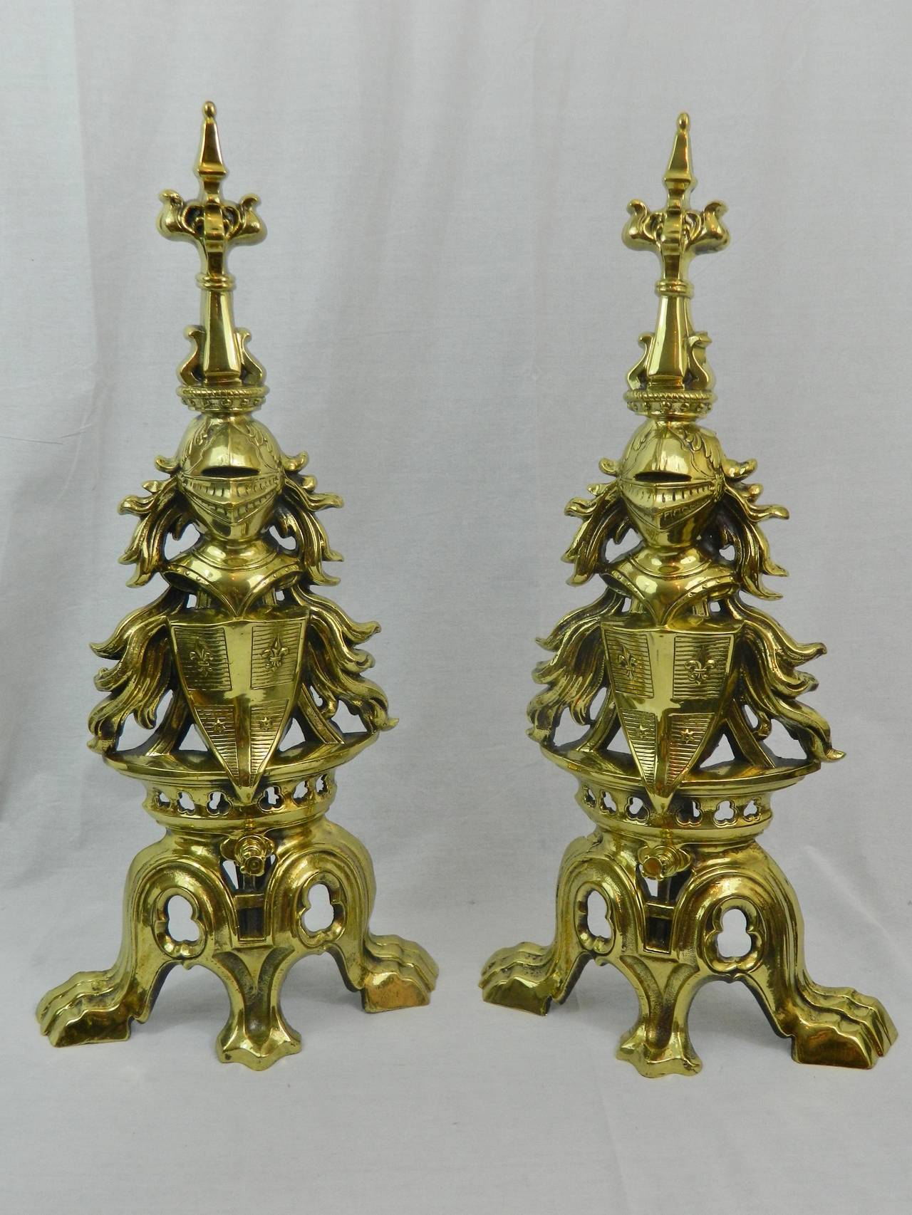 19th century pair of armorial polished brass Chenet or andirons and bar.