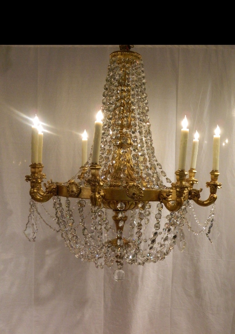 19th century large giltwood eight light chandelier with crystal swags and shells motif. Fitted with tall beeswax sleeves. Fully rewired.