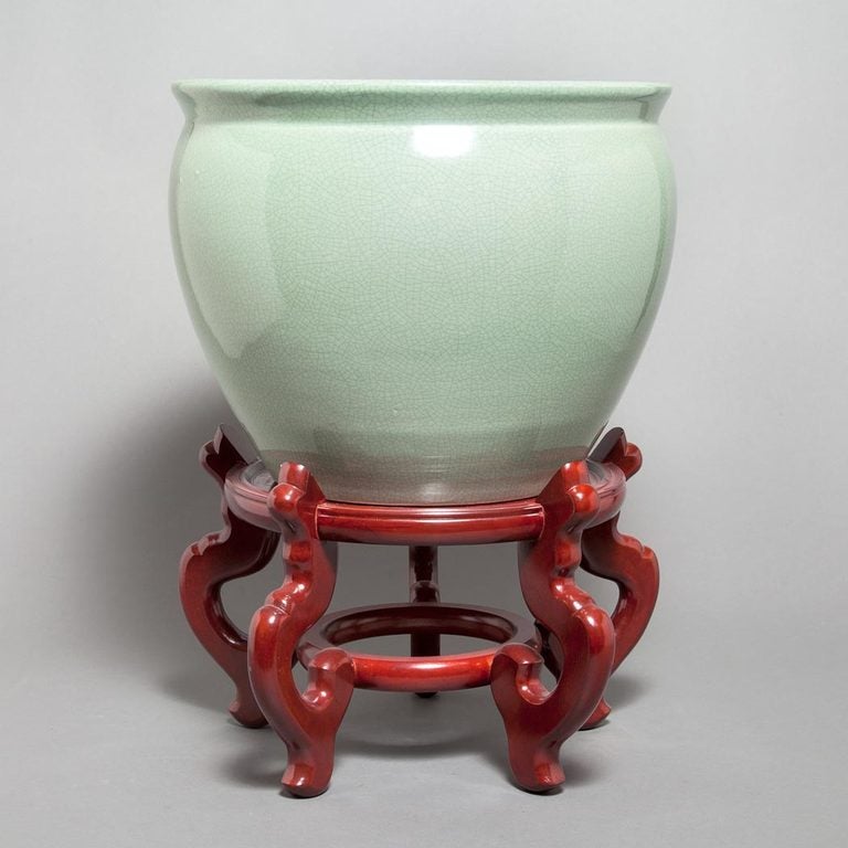 Pair of 20th Century Chinese Crackled Celadon Glazed Porcelain Jardinieres on Rosewood Stands.  Height overall 20 inches.  Jardiniere dimensions:  11.75
