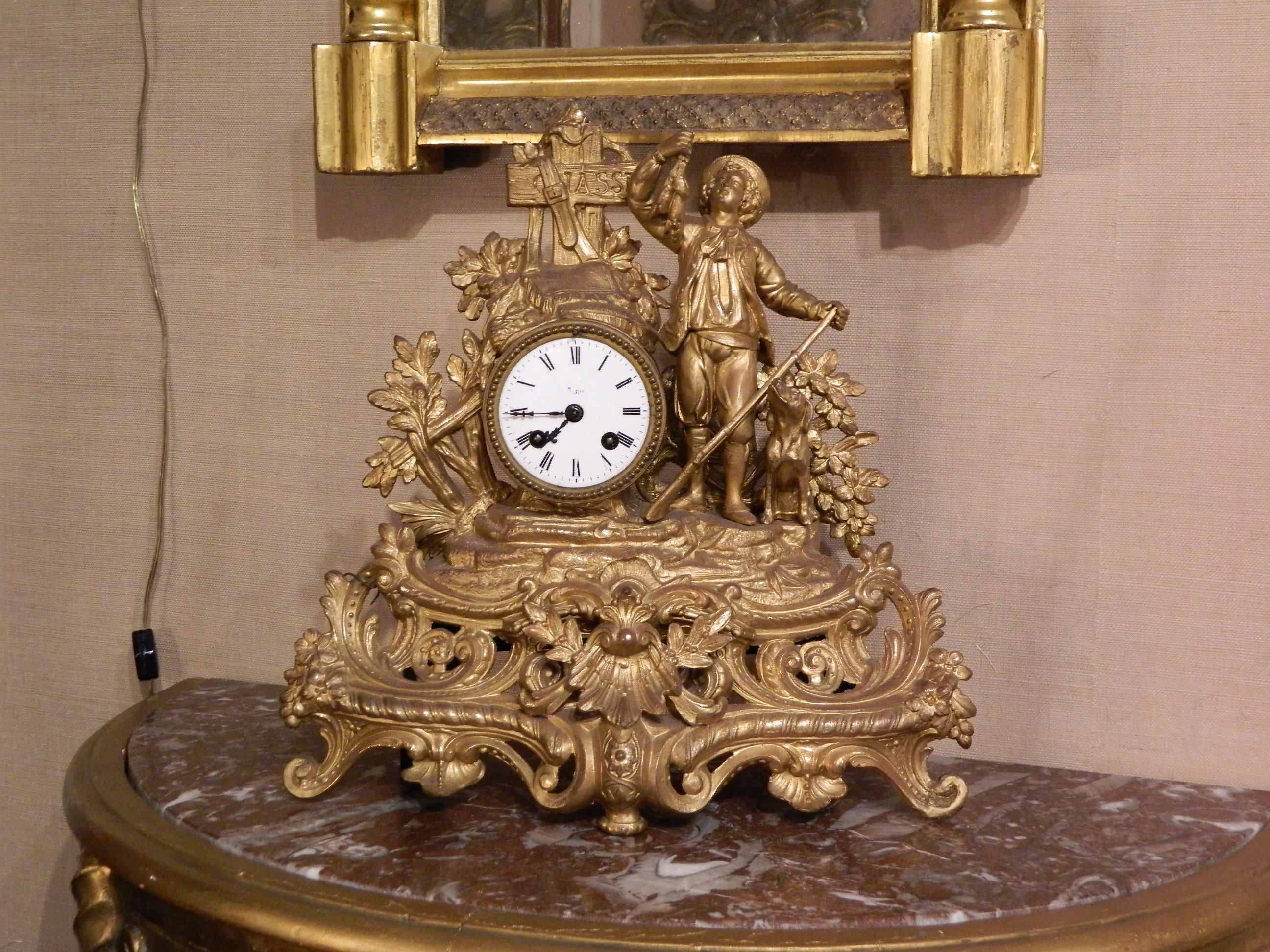French Gilded Mantel Clock "Man Holding Fowl"