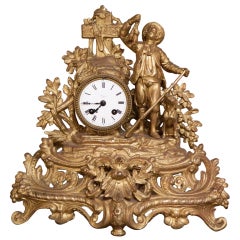 French Gilded Mantel Clock "Man Holding Fowl"