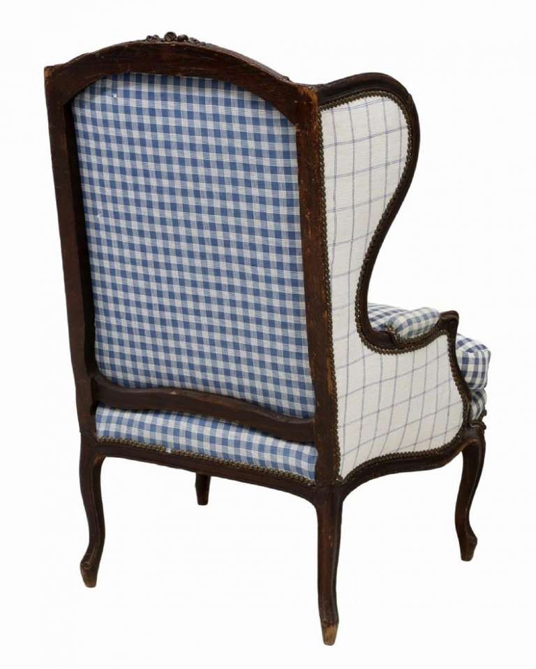 Early 19th Century French Louis XV Style Oak Wing Back Arm Chair on Cabriole Legs, having blue and white Ralph Lauren checkered upholstery, removable down seat cushion