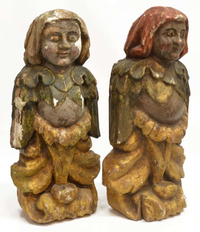 Bois Paire de figures continentales en bois doré et polychromé en niches, 19ème siècle en vente