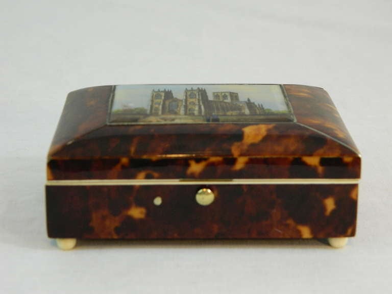 19th Century Tortoise Shell Inset Box having a miniature architecture view of Yorkminster with ivory banding and feet, opening to a mother-of-pearl carved plaque