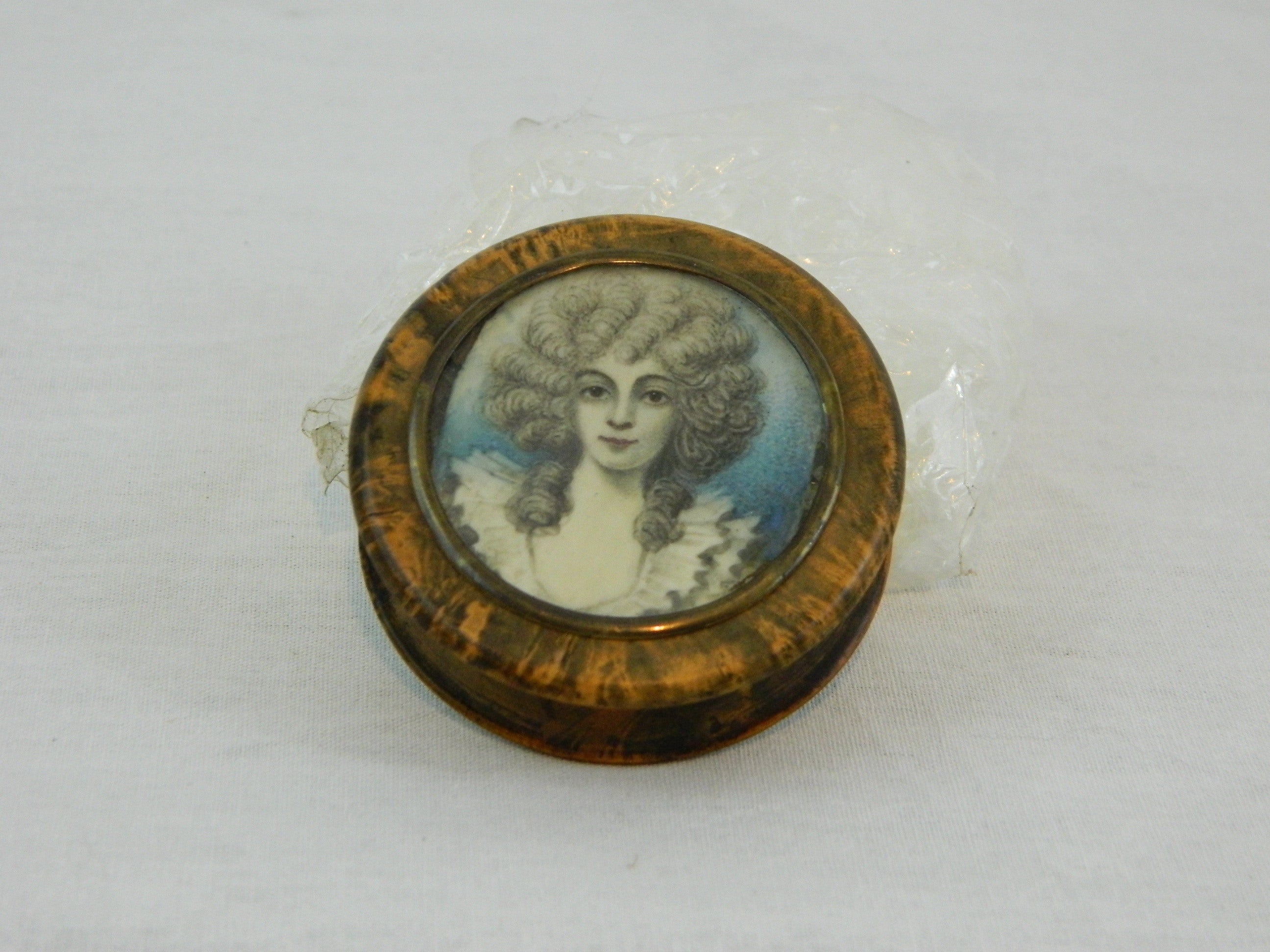 A Horn Snuff Box Inset with a Portrait Miniature Depicting a Lady