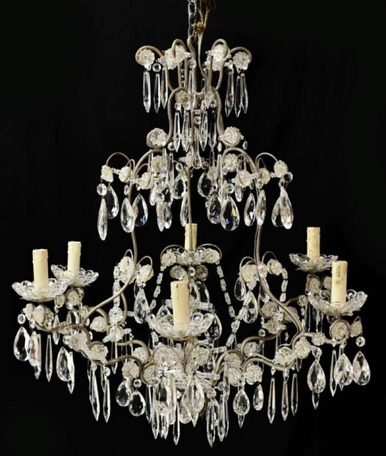 Early 20th Century Italian Silvered Metal and Crystal Six Light Chandelier, the scrolled frame hung with faceted prisms and flower heads, glass bobeche