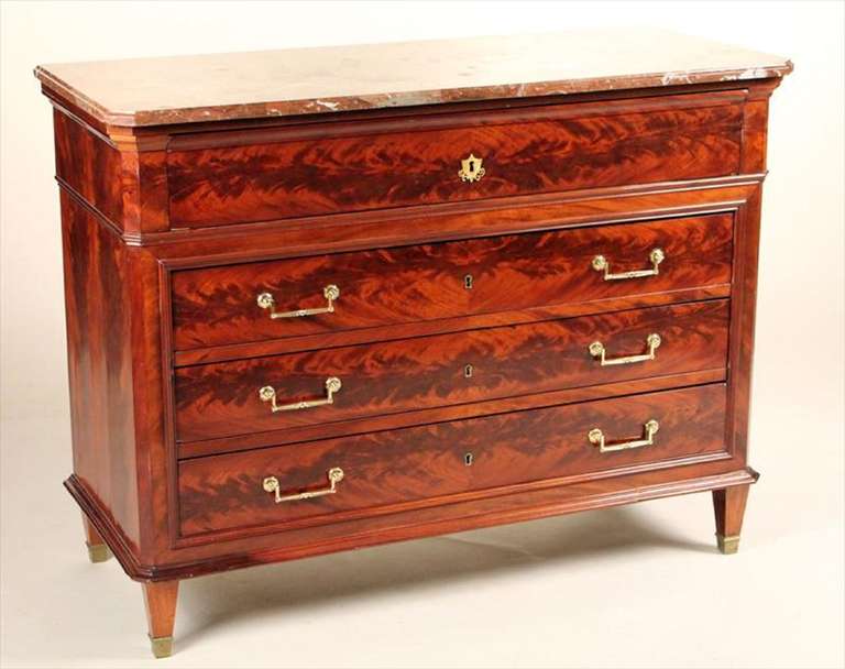 Circa 1840 Empire Mahogany Marble-Top Commode, secretary, or chest, French.  It opens to a desk with a leather top and several small drawers over three large drawers 
