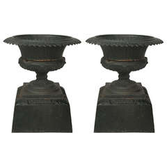 19th Century Pair of American Labeled Kramer Brothers Cast Iron Urns on Plinths