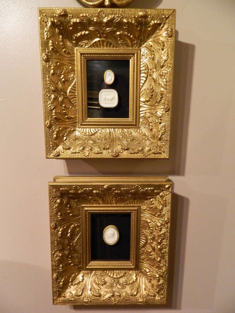 Set of three framed plaster intaglios in antique Italian giltwood frames and black velvet mats. Each intaglio depicting of a famous sculpture, personage or work of art.