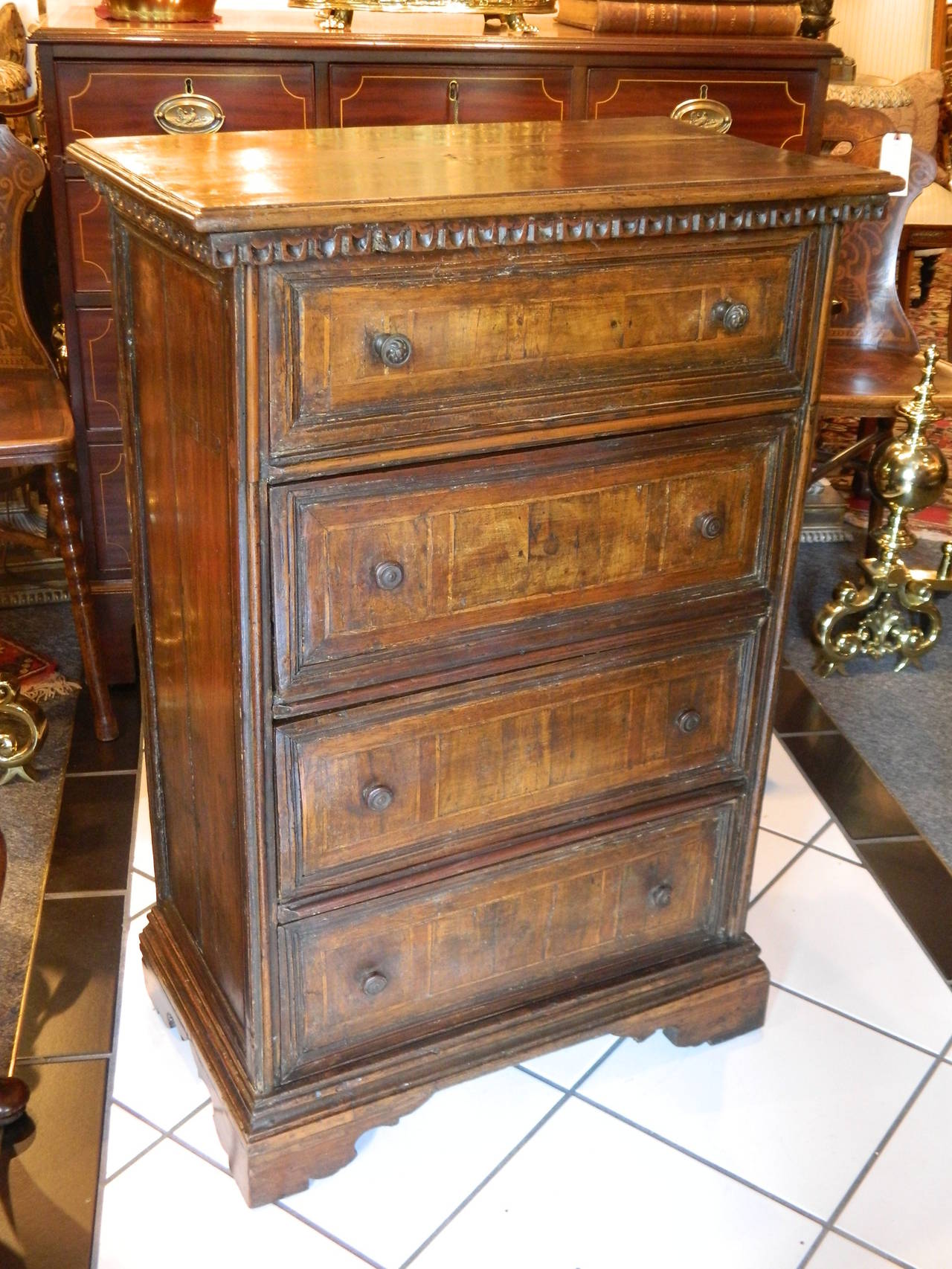 Italian Walnut Four Drawer Commodino or Chest of Drawers on Bracket Feet, 17th Century.  Provenance: Deaccessioned from a Westchester County Museum