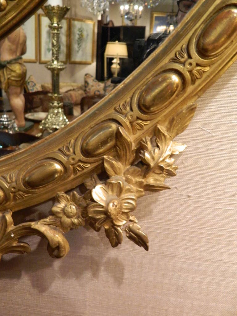 English 24-Karat Water Gilt Oval Mirror Adorned with Cherubs and Shells In Good Condition In Savannah, GA