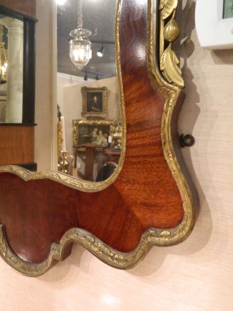 English George II-Style Mahogany and Parcel Gilt Mirror with a Gilt Phoenix Finial